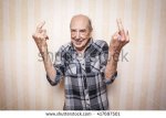 stock-photo-cool-funny-elder-man-making-middle-finger-sign-417697501.jpg