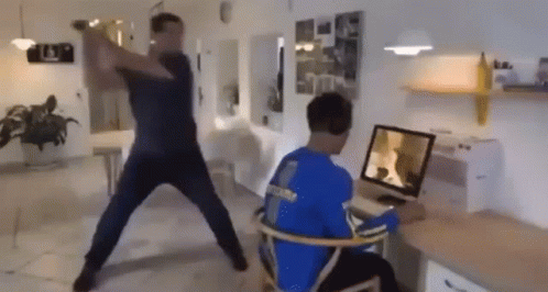 hitting-someone-with-a-bat-hitting-a-guy-into-a-screen.gif